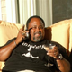 Lawrence Bobo relaxing with a martini and cigar.